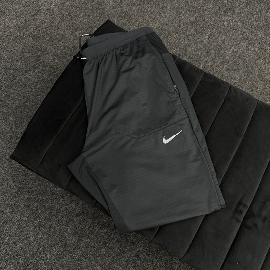 NIKE STRIDE PHENOM TRACK PANTS