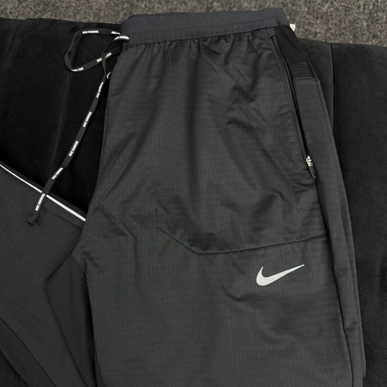 NIKE STRIDE PHENOM TRACK PANTS